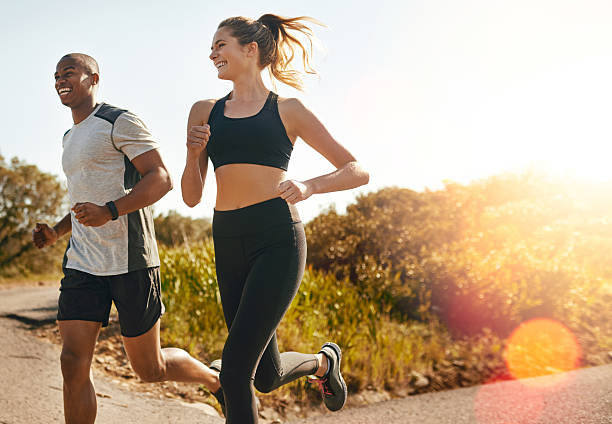 a man and woman running and exercising, part of healthy habits for 2023